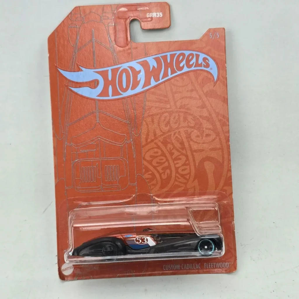 Hot Wheels Custom Cadillac Fleetwood negro con detalles azules y blancos, en empaque naranja GRR35 5/5. by Remates Narvaja